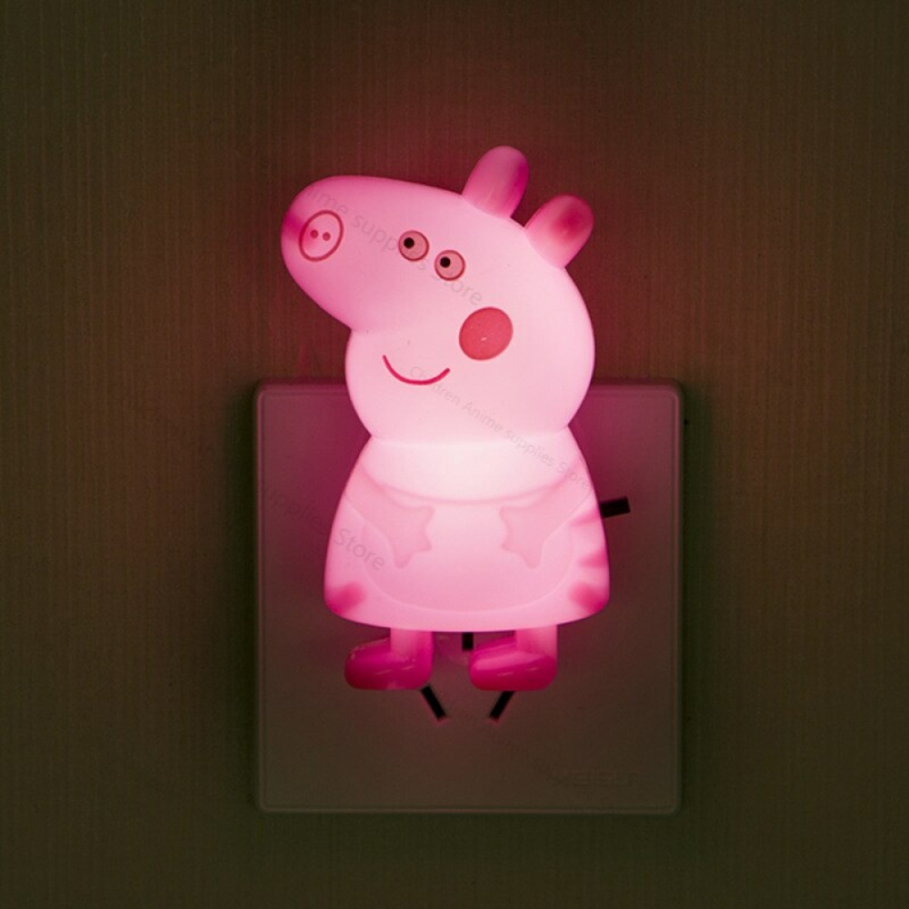 Luce notturna da parete Peppa Pig rosa per bambini su una presa di corrente