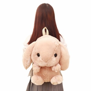 Zaino a forma di coniglio coccoloso rosa da bambina sulla schiena di una bambina