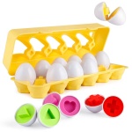 Giocattoli educativi a forma di uovo per bambini con cestino giallo e forme colorate