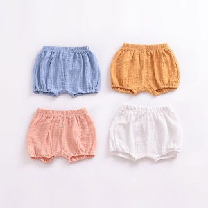 Pantaloncini di lino plissettati per bambini in arancione, bianco, blu e rosa
