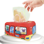 scatola di fazzoletti rossa a forma di autobus con animali all'interno, in cui un bambino inserisce i fazzoletti